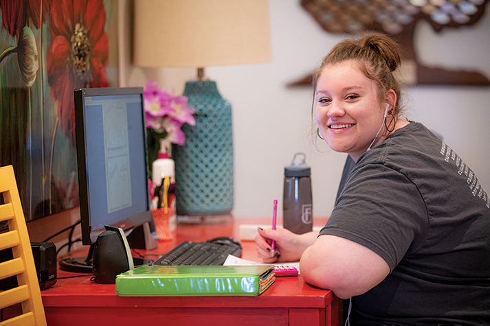 OBHC resident studying at her desk