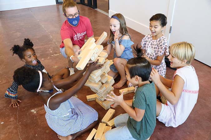 Photo of kids playing Jenga in Frontline's newly renovated east wing