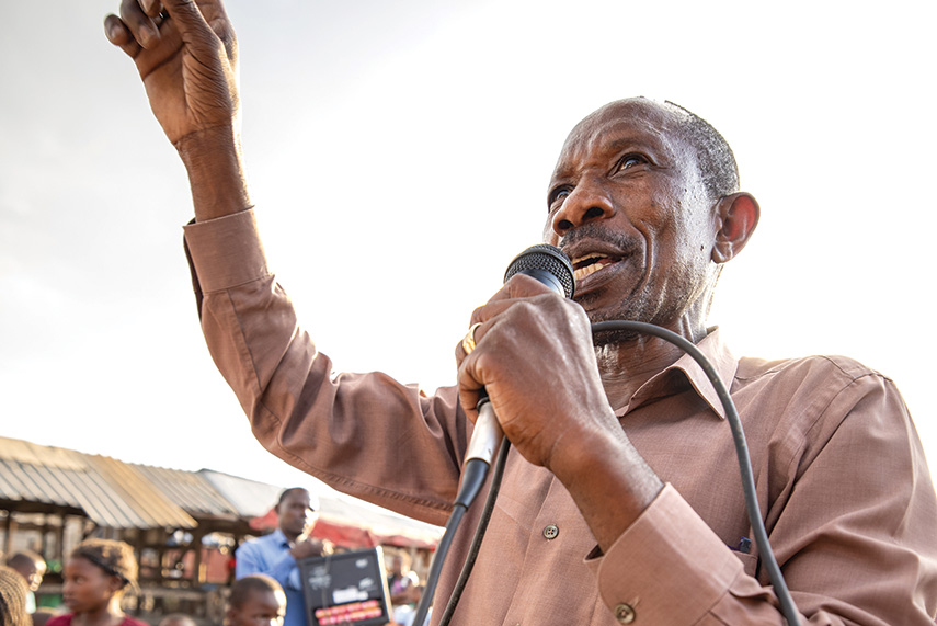 Man preaching in open-air market