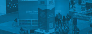 Blue gradient photo of WatersEdge SBC Booth from 2023